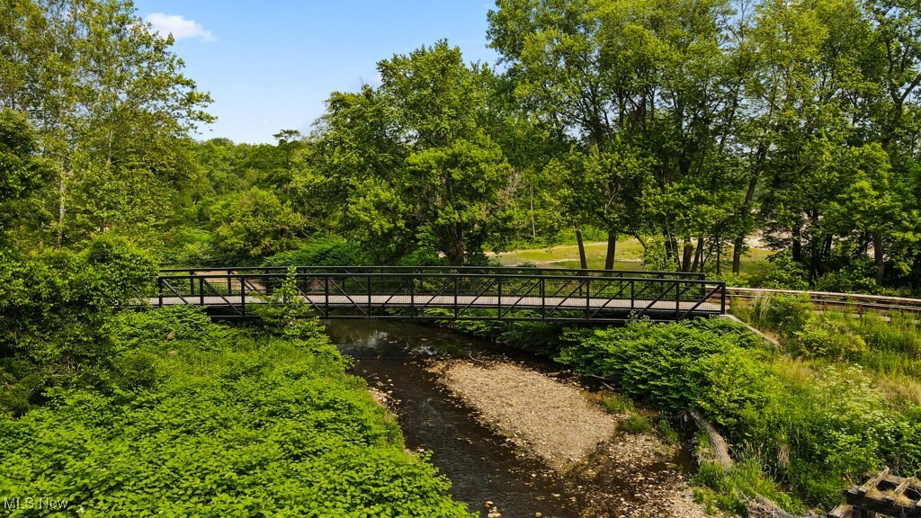 5000 Warner Road Garfield Heights, OH 44125 - Photo 14 of 41 Surrounding community featuring a balcony, a water view, and view of wooded area