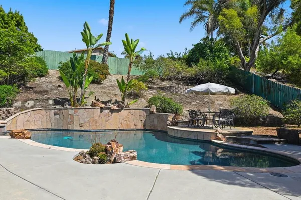 a view of a swimming pool with a patio