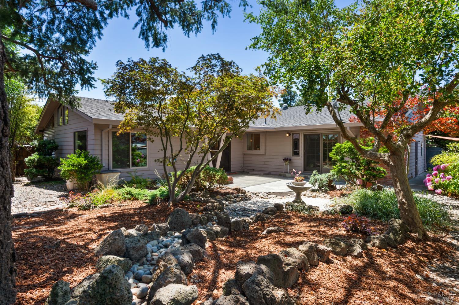 1414 Manhattan Way Santa Rosa, CA 95401 - Photo 1 of 1 a front view of a house with a garden