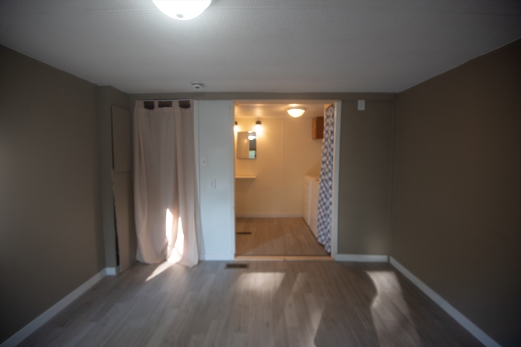 20 Dana Road Barre, MA 01005 - Photo 25 of 38 an empty room with wooden floor and windows