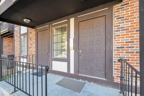 a view of a balcony with wooden floor