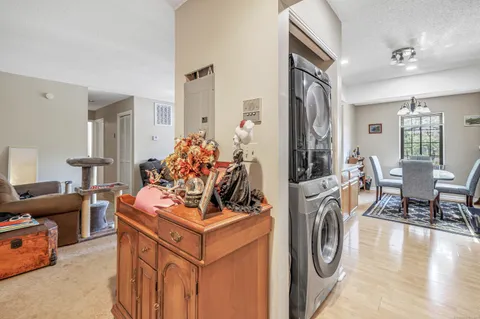 a dining room with furniture and wooden floor