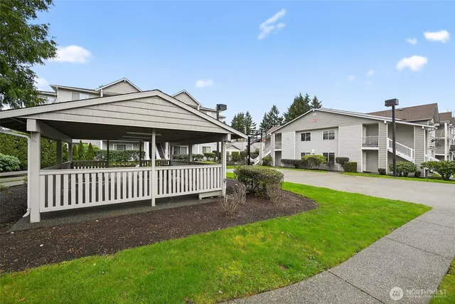 a view of a big room with swimming pool and deck