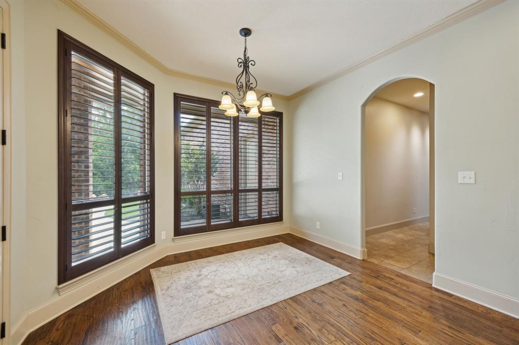 301 Harrison Circle Van Alstyne, TX 75495 - Photo 18 of 38 an empty room with wooden floor and windows