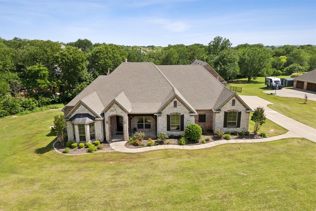 301 Harrison Circle Van Alstyne, TX 75495 - Photo 2 of 38 a front view of a house with a yard