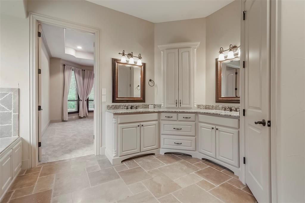 301 Harrison Circle Van Alstyne, TX 75495 - Photo 21 of 38 a spacious bathroom with a granite countertop sink and a mirror