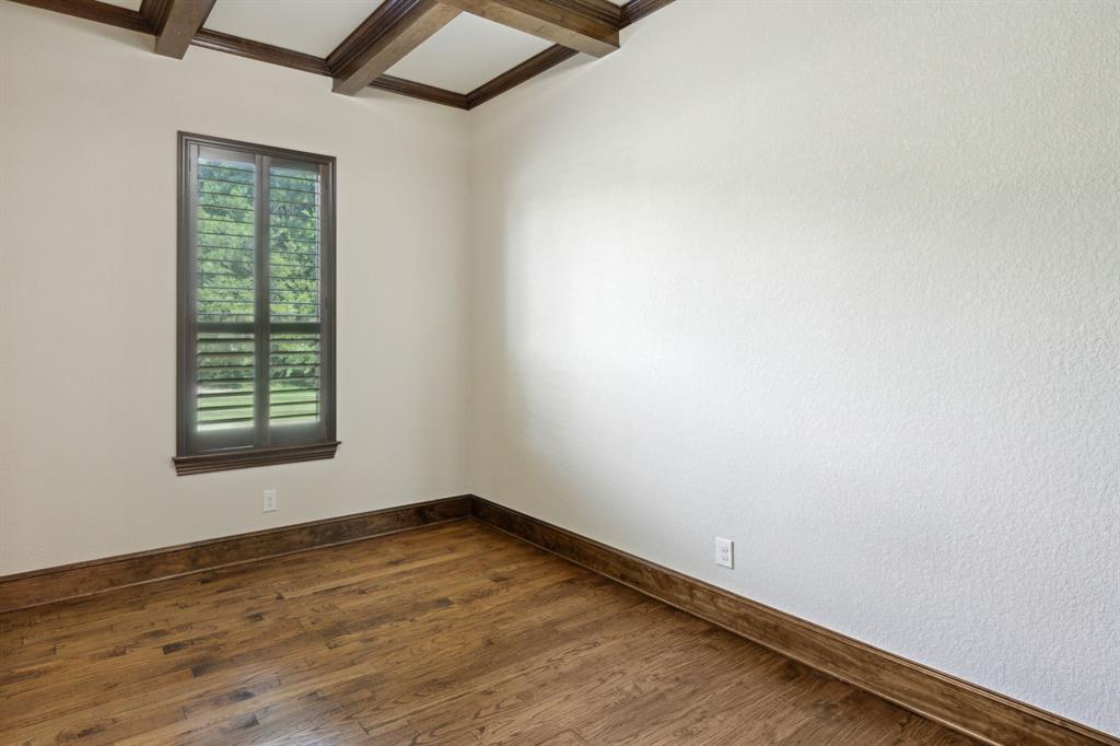 301 Harrison Circle Van Alstyne, TX 75495 - Photo 25 of 38 an empty room with wooden floor and windows