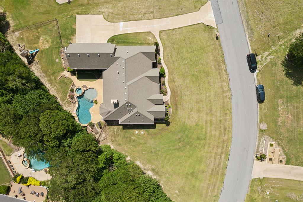 301 Harrison Circle Van Alstyne, TX 75495 - Photo 6 of 38 an aerial view of a house with swimming pool