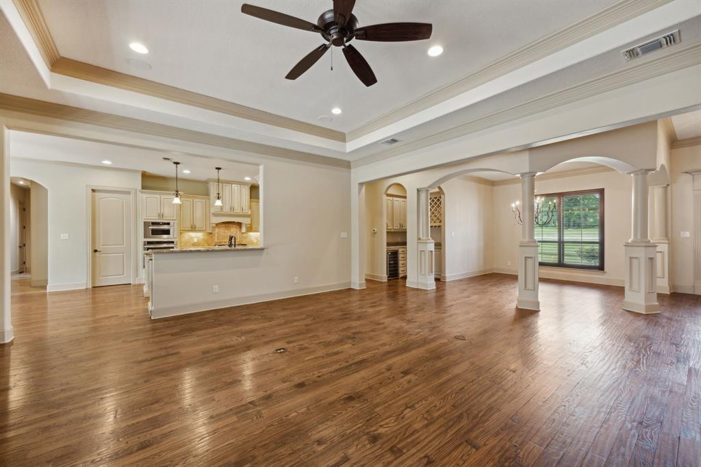 301 Harrison Circle Van Alstyne, TX 75495 - Photo 10 of 38 wooden floor in an empty room with a window