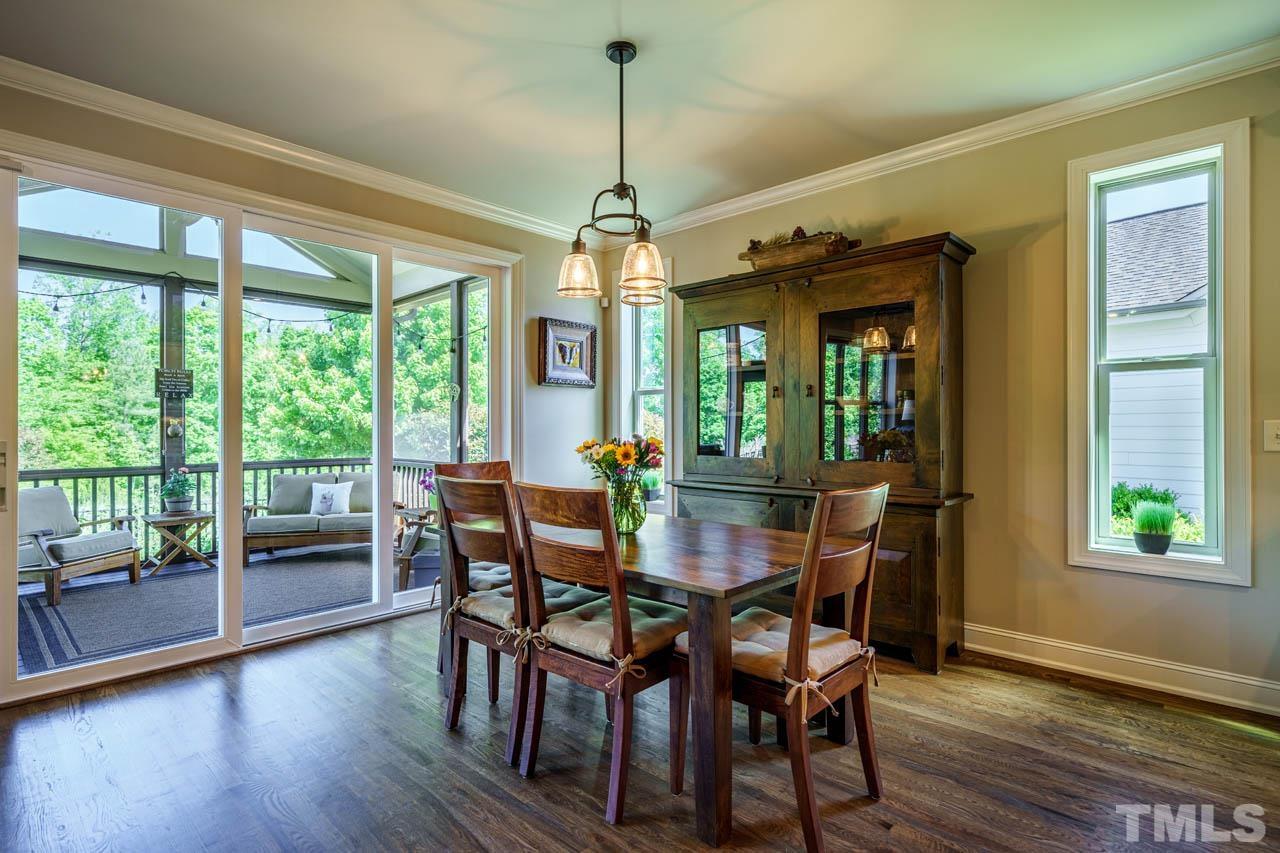 394 Cliffdale Road Chapel Hill, NC 27516 - Photo 19 of 66 a dining room with furniture window wooden floor