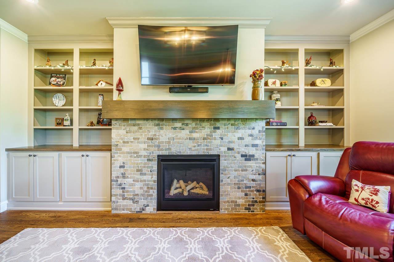394 Cliffdale Road Chapel Hill, NC 27516 - Photo 22 of 66 a living room with furniture and a fireplace