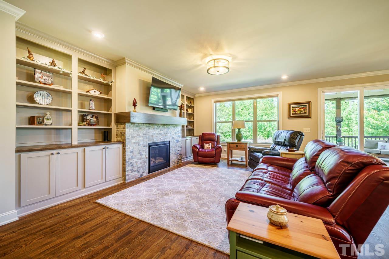 394 Cliffdale Road Chapel Hill, NC 27516 - Photo 23 of 66 a living room with furniture and a fireplace