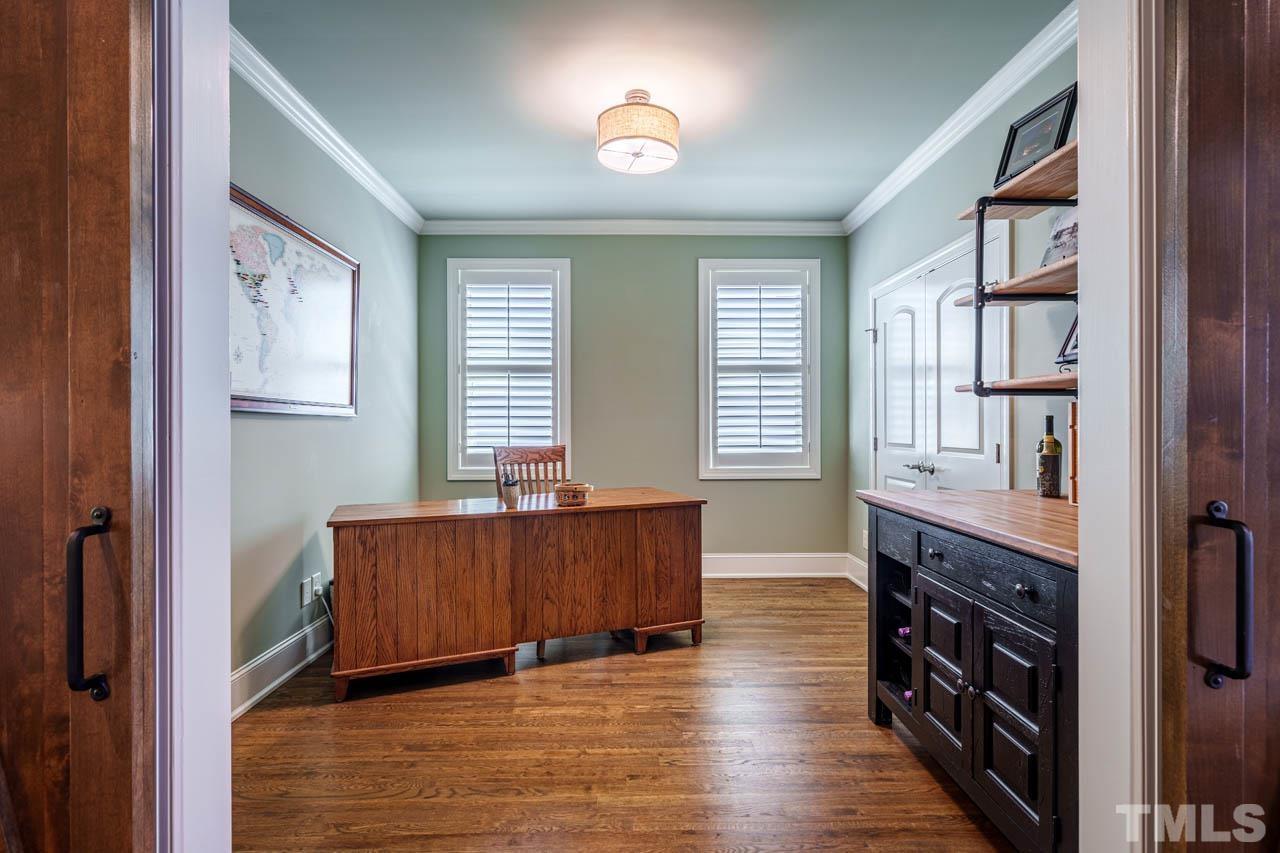 394 Cliffdale Road Chapel Hill, NC 27516 - Photo 26 of 66 a living room with furniture and a book shelf