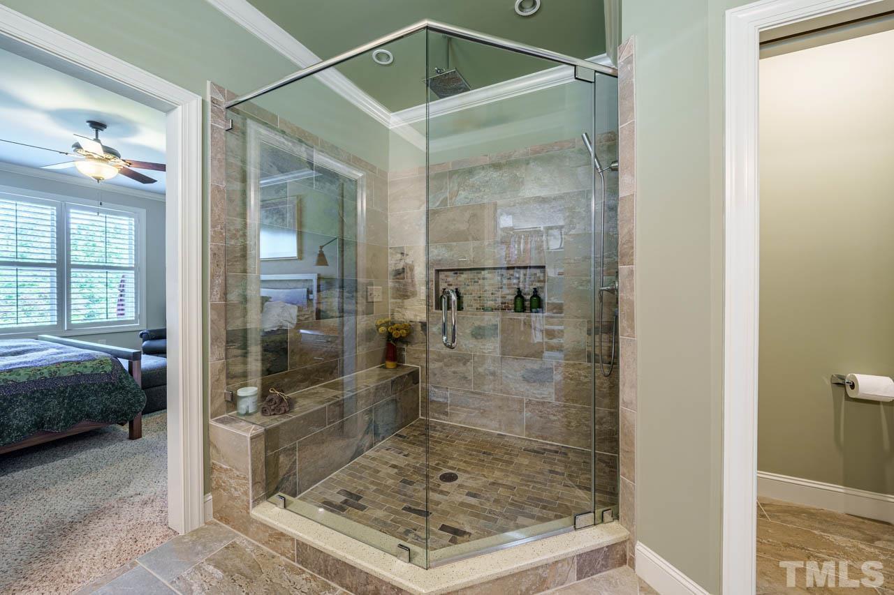 394 Cliffdale Road Chapel Hill, NC 27516 - Photo 30 of 66 a bathroom with a shower and a sink