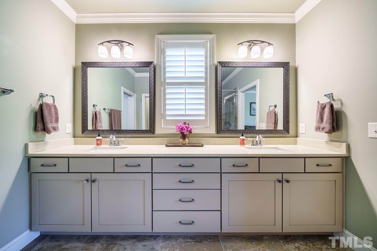 394 Cliffdale Road Chapel Hill, NC 27516 - Photo 31 of 66 a bathroom with a sink and a mirror