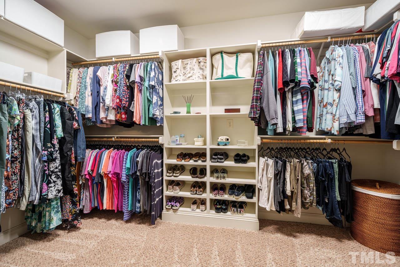 394 Cliffdale Road Chapel Hill, NC 27516 - Photo 32 of 66 a view of walk in closet with clothes