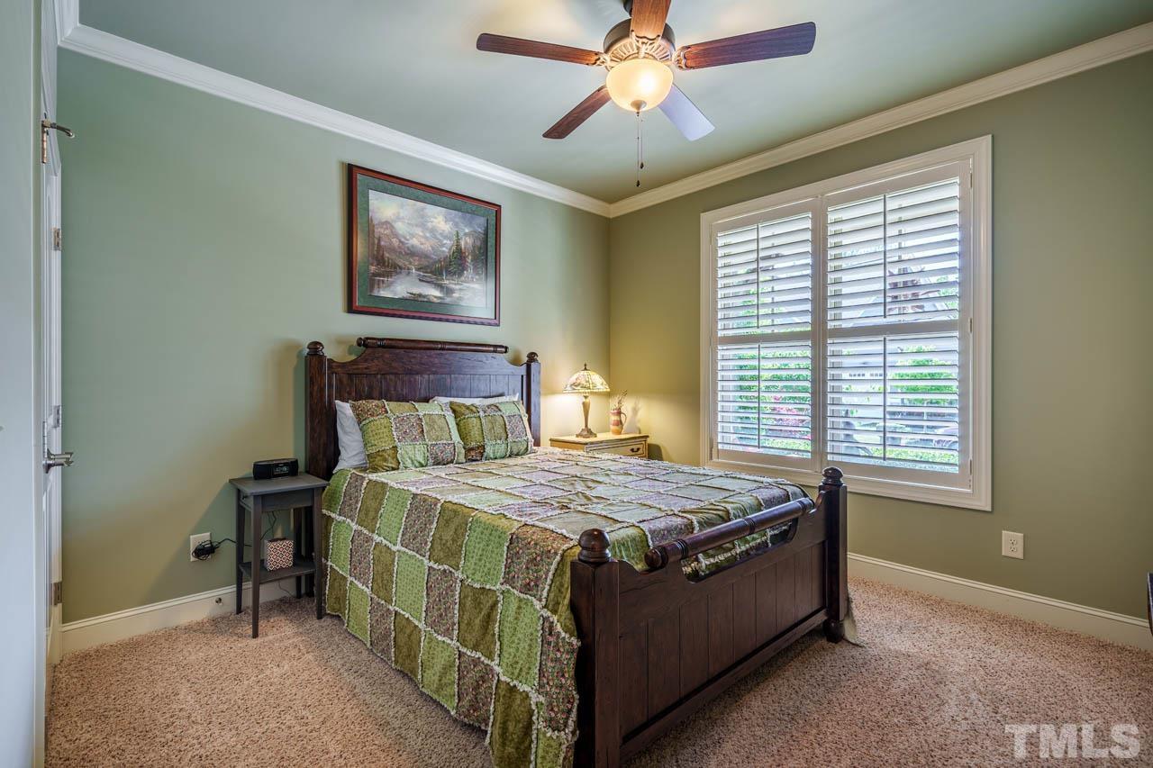 394 Cliffdale Road Chapel Hill, NC 27516 - Photo 33 of 66 a bed sitting in a bedroom next to a window