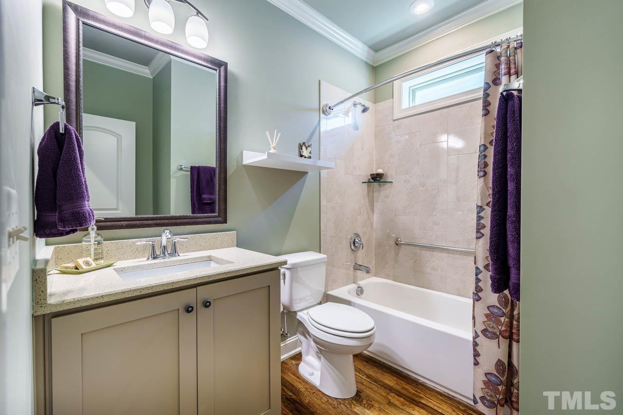 394 Cliffdale Road Chapel Hill, NC 27516 - Photo 34 of 66 a bathroom with a sink a toilet and shower