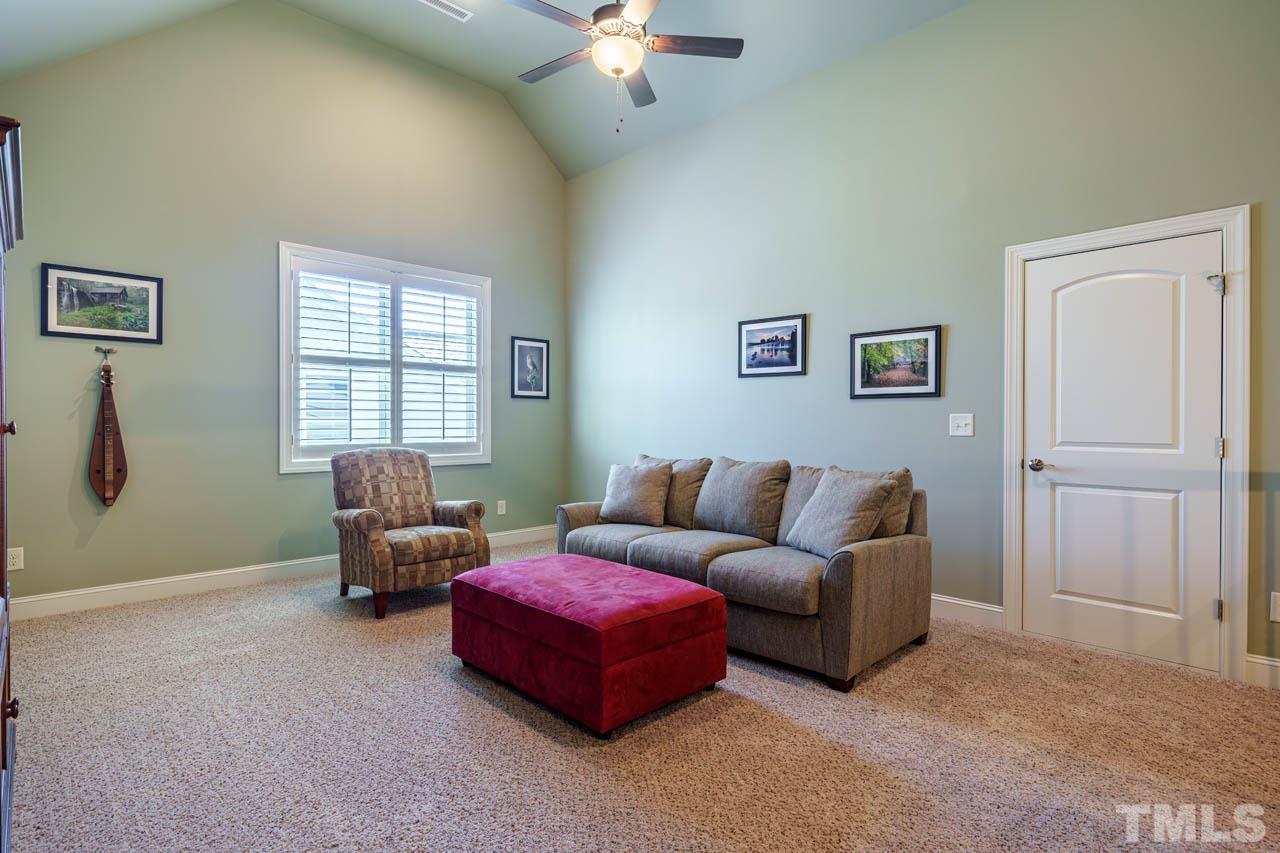 394 Cliffdale Road Chapel Hill, NC 27516 - Photo 39 of 66 a living room with furniture and a window