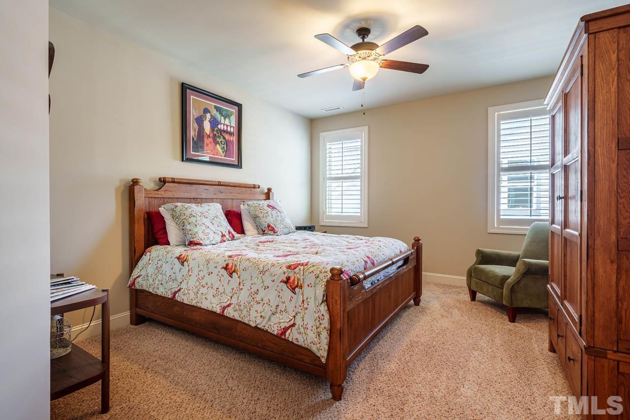394 Cliffdale Road Chapel Hill, NC 27516 - Photo 40 of 66 a bedroom with a bed rug and window