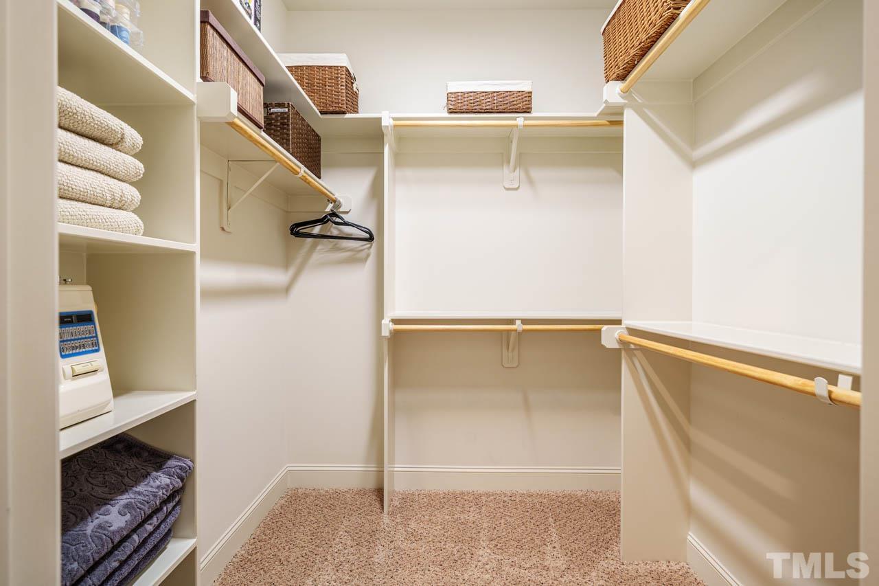 394 Cliffdale Road Chapel Hill, NC 27516 - Photo 41 of 66 a view of walk in closet with clothes and shoes