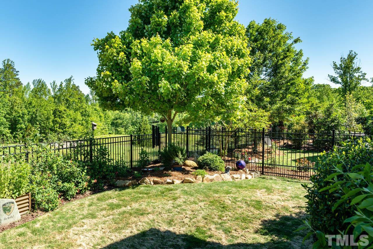 394 Cliffdale Road Chapel Hill, NC 27516 - Photo 51 of 66 a view of backyard with swimming pool and seating space