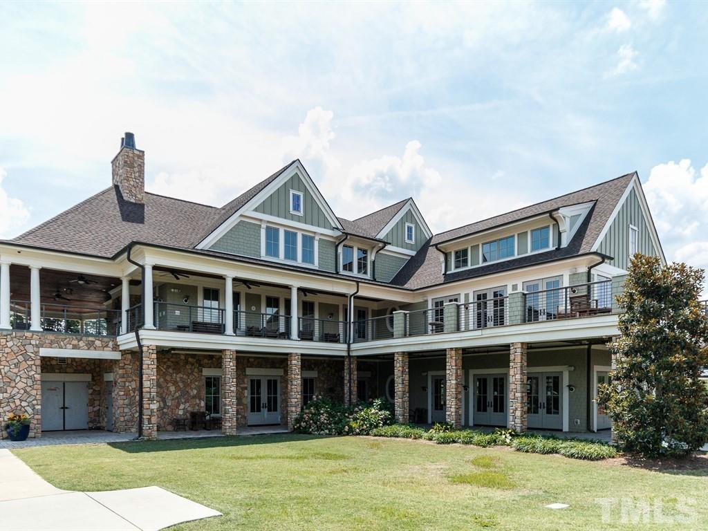 394 Cliffdale Road Chapel Hill, NC 27516 - Photo 55 of 66 a front view of a building with a garden