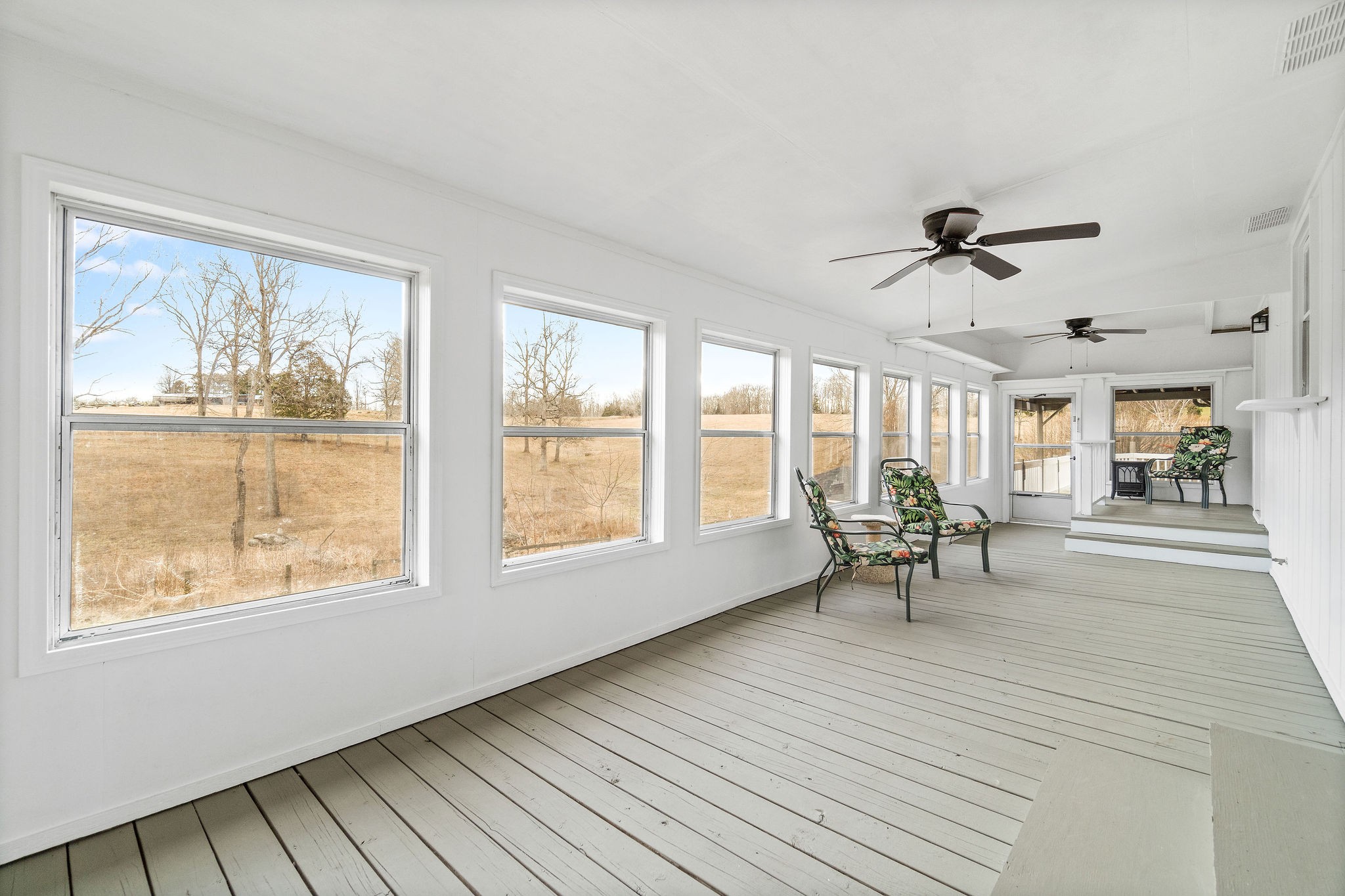 1751 Jim Kim Road Cunningham, TN 37052 - Photo 14 of 41 a view of a livingroom with wooden floor and a large window