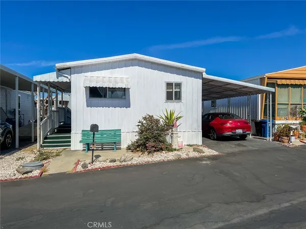 a house with car parked in front of it