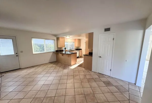a view of a kitchen with windows cabinet and windows