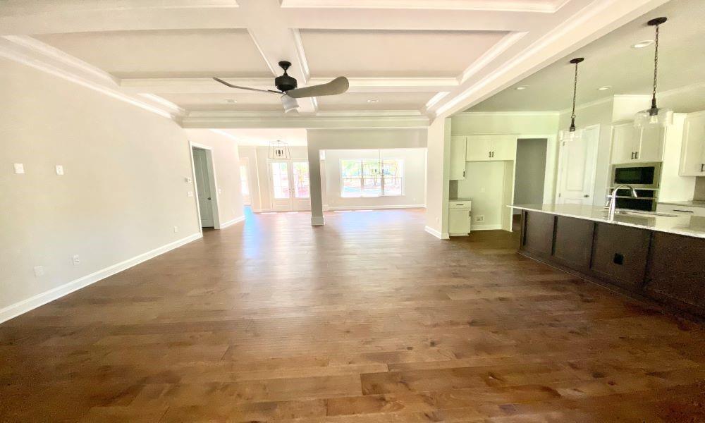 3848 Poplar Tent Road Concord, NC 28027 - Photo 8 of 12 a large kitchen with cabinets and wooden floor