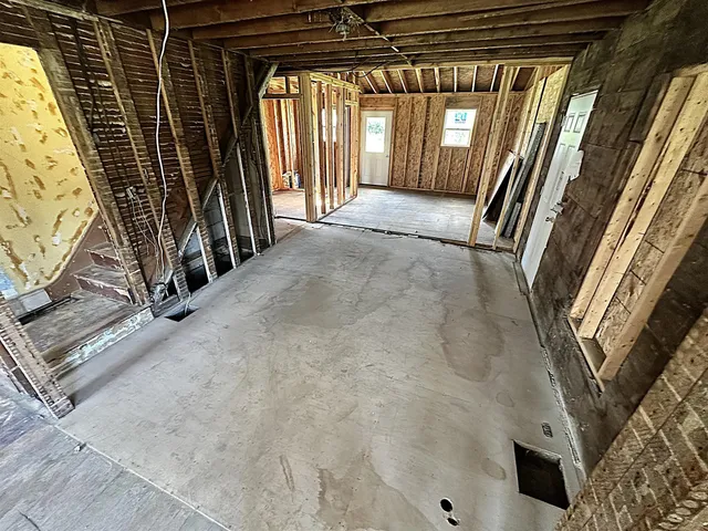 a view of an entryway with wooden floor