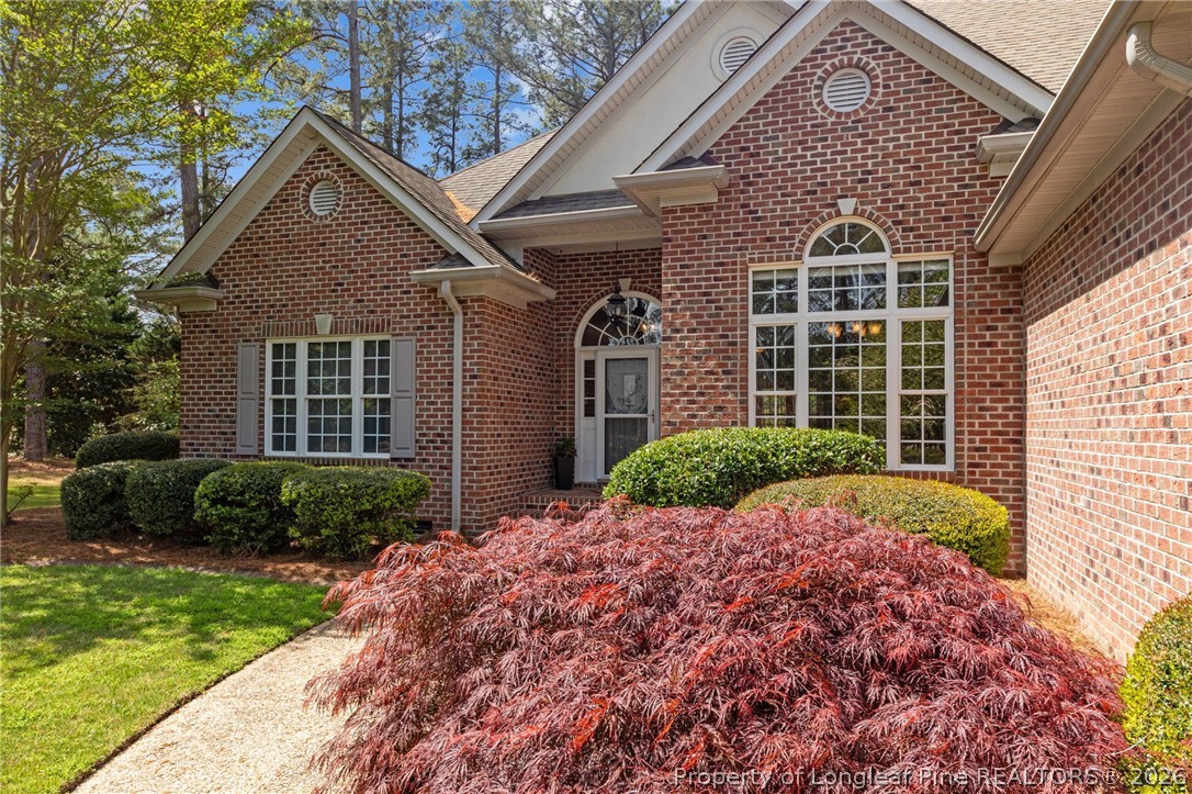 30180 East Lake Road Wagram, NC 28396 - Photo 3 of 42 a front view of a house with garden