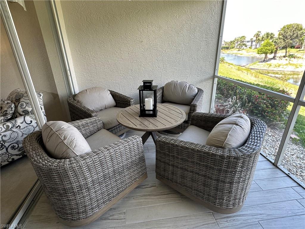 6816 Satinleaf Road South, Unit 102 Naples, FL 34109 - Photo 20 of 35 a living room with furniture