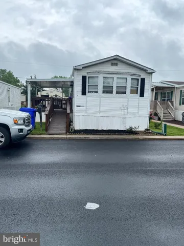 a view of multiple houses with yard