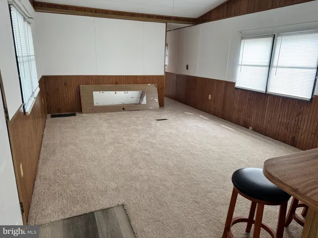 a room with a table and chairs