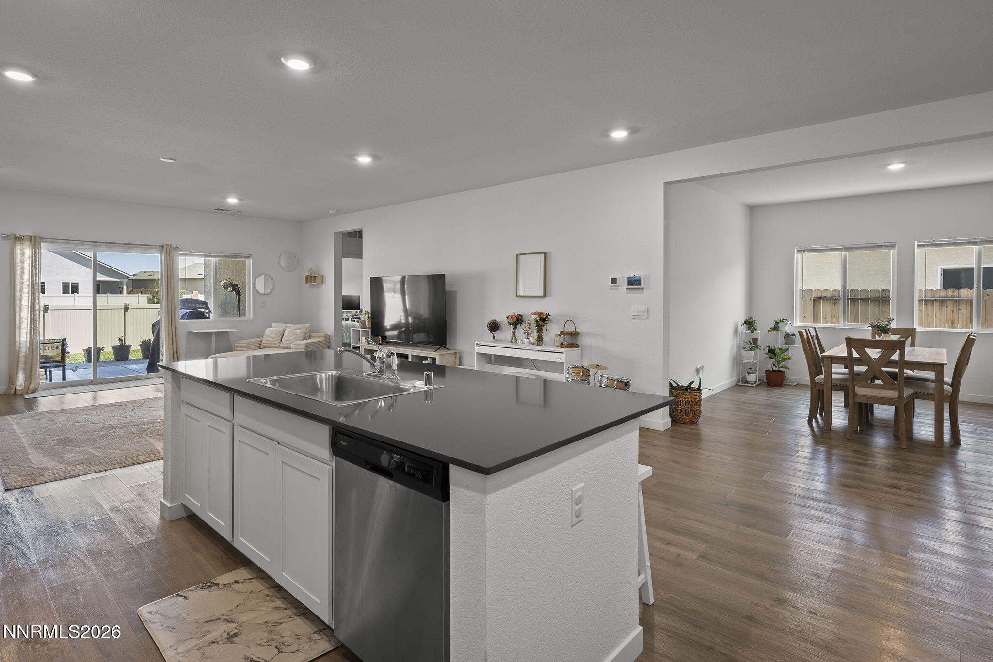 738 Butte Creek Road Dayton, NV 89403 - Photo 7 of 28 a kitchen with center island with sink stainless steel appliances and dining table