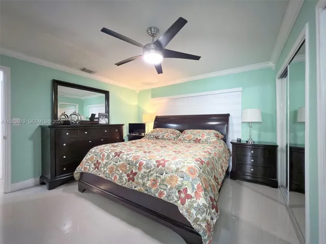 a bathroom with a double vanity sink mirror and shower