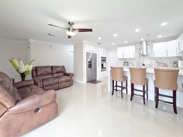 a living room with furniture and white walls