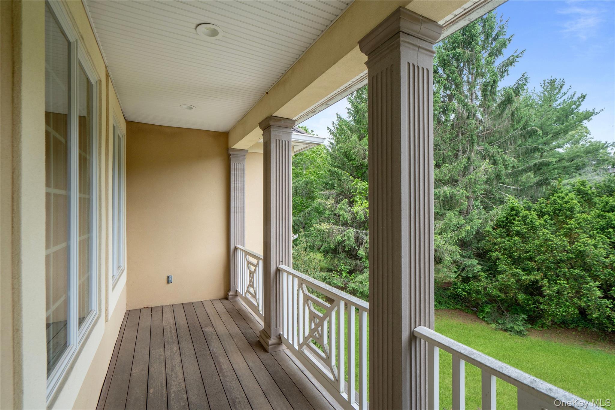 1960 Midlane Road South Syosset, NY 11791 - Photo 43 of 46 a view of a porch with wooden floor and outdoor space