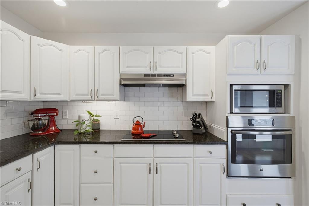 2800 Spencers Grove Road Browns Summit, NC 27214 - Photo 19 of 49 Cooktop with wall oven and microwave.