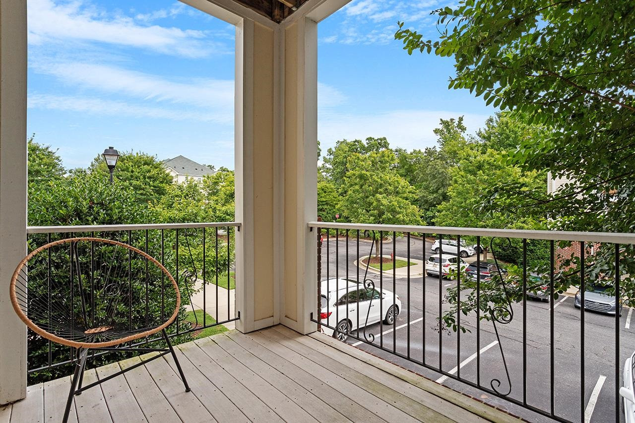 900 Canenaugh Drive, Unit 201 Raleigh, NC 27604 - Photo 1 of 28 a view of a balcony with wooden floor