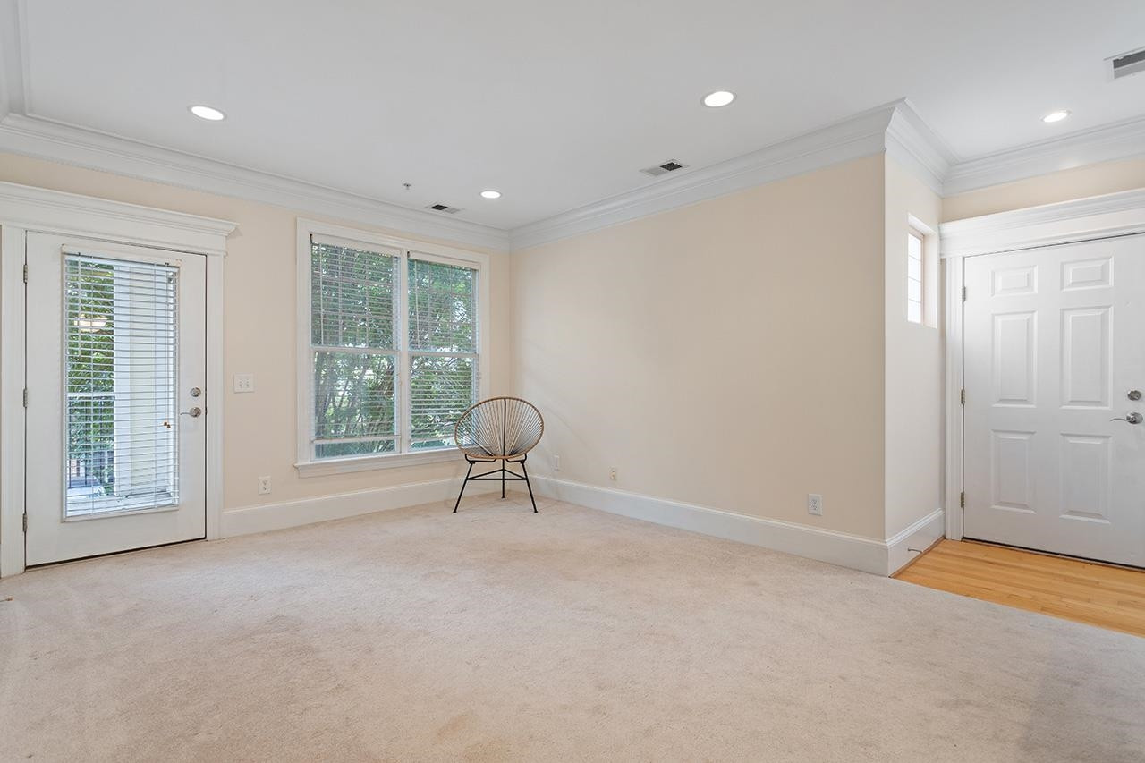 900 Canenaugh Drive, Unit 201 Raleigh, NC 27604 - Photo 11 of 28 a view of an empty room with a window