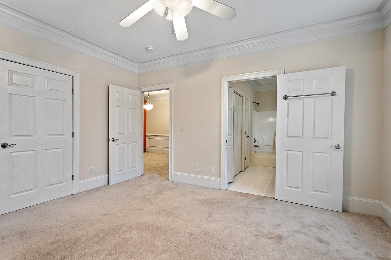 900 Canenaugh Drive, Unit 201 Raleigh, NC 27604 - Photo 12 of 28 an empty room with fan and entrance