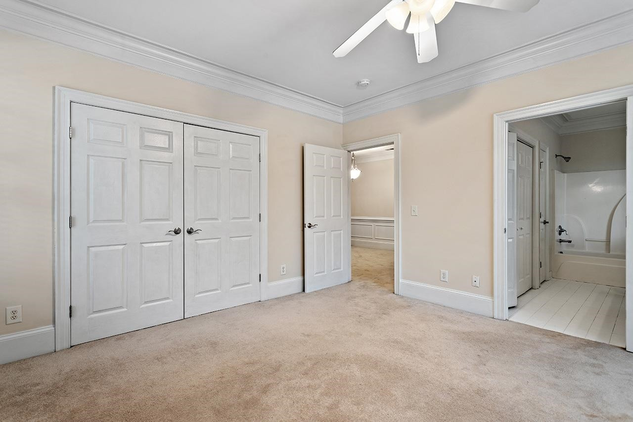 900 Canenaugh Drive, Unit 201 Raleigh, NC 27604 - Photo 13 of 28 an empty room with a bathroom and a mirror