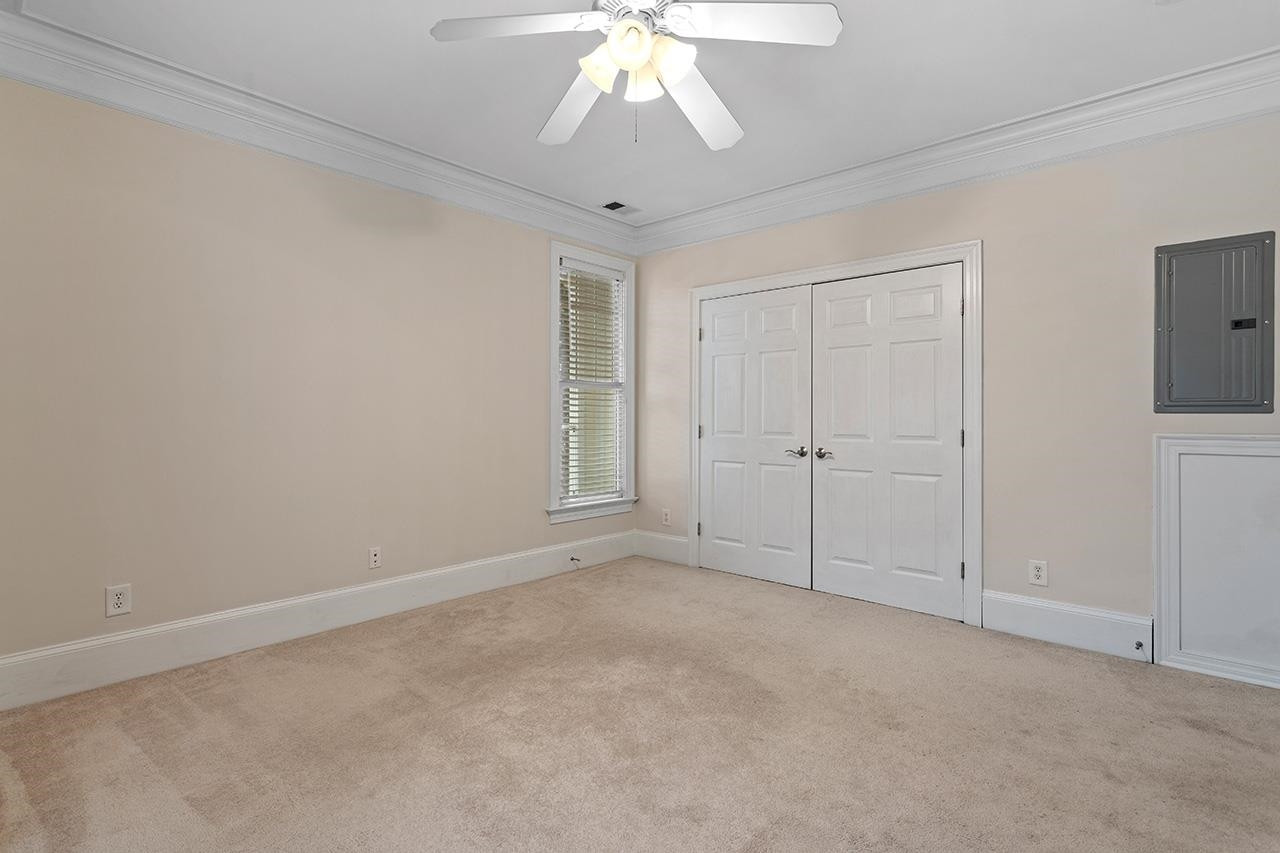 900 Canenaugh Drive, Unit 201 Raleigh, NC 27604 - Photo 14 of 28 an empty room with chandelier fan
