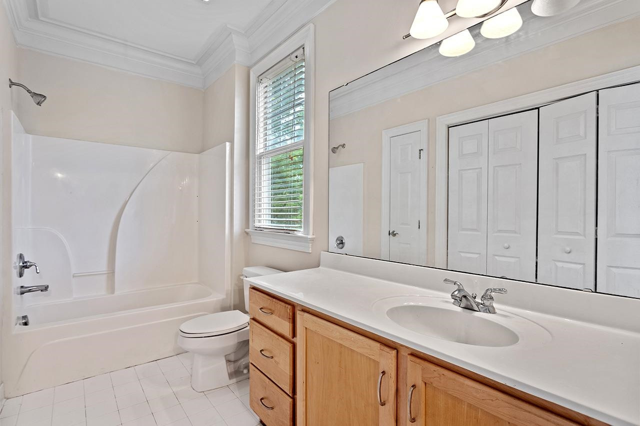 900 Canenaugh Drive, Unit 201 Raleigh, NC 27604 - Photo 16 of 28 a bathroom with a sink a toilet and a bathtub