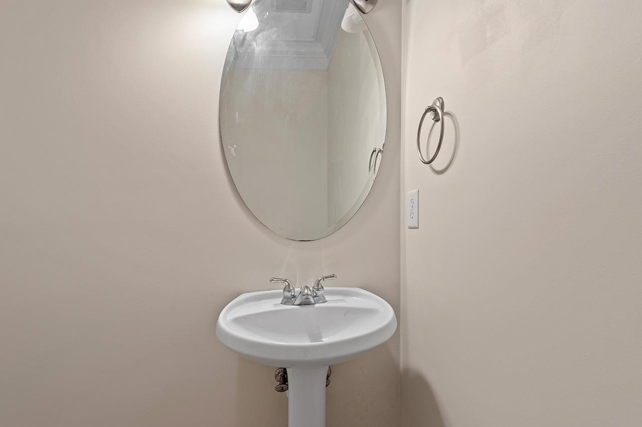 900 Canenaugh Drive, Unit 201 Raleigh, NC 27604 - Photo 18 of 28 a bathroom with a sink and a mirror