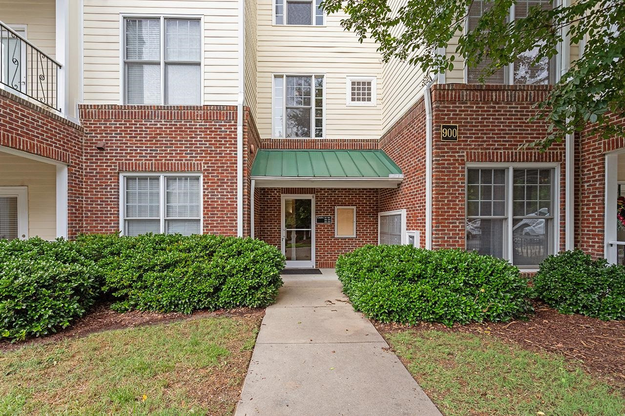 900 Canenaugh Drive, Unit 201 Raleigh, NC 27604 - Photo 23 of 28 a front view of house with yard and green space