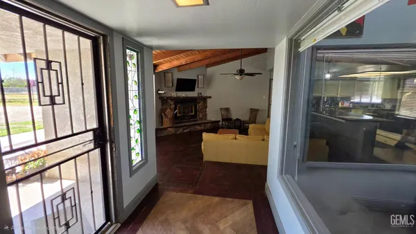a bedroom with a bed and a potted plant